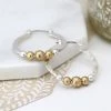 Mooch..... New Arrivals Peace Of Mind Silver Plated Silver Plated Silver And Gold Plated Hoops And Beads Earrings